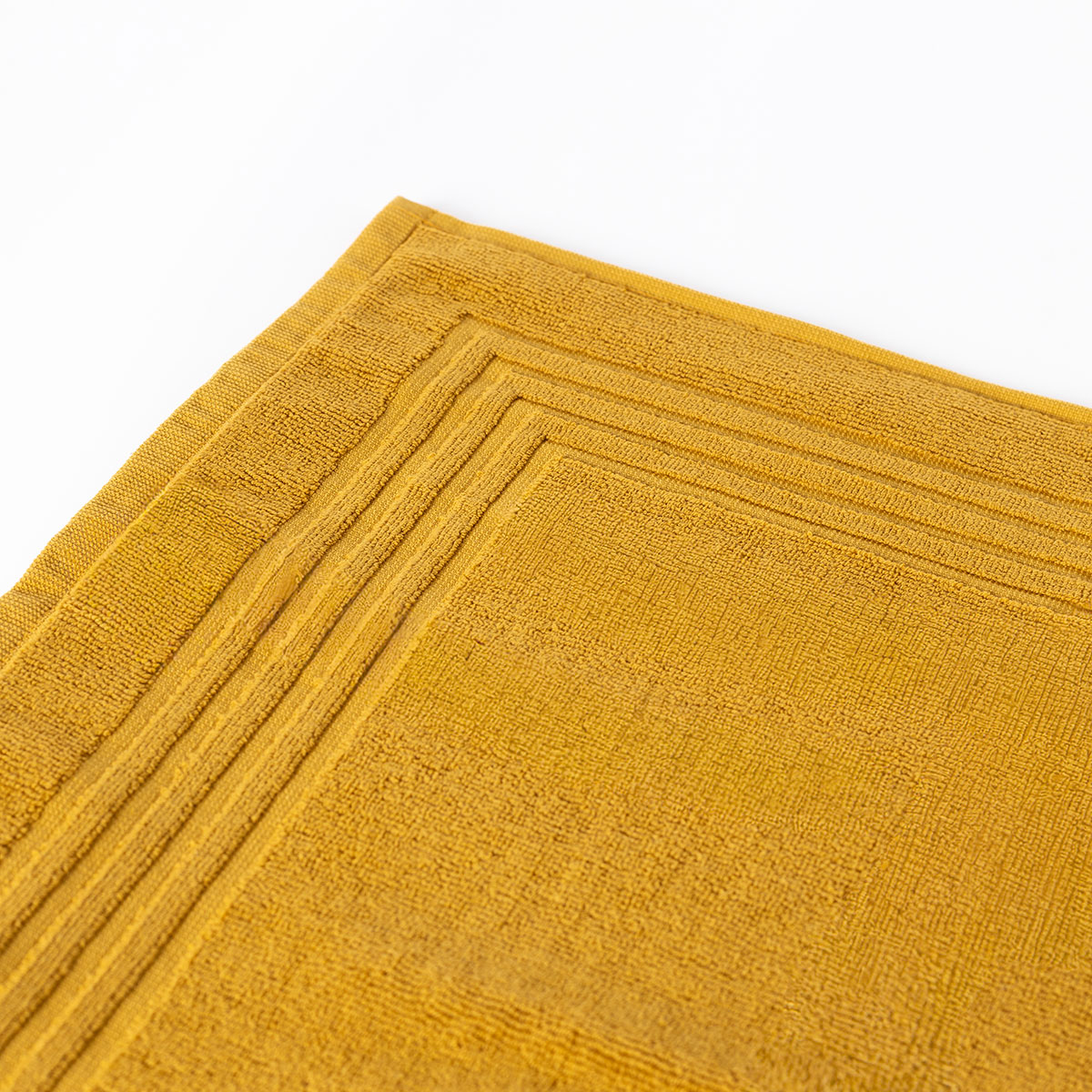 Alfombra de ba&ntilde;o ESSENZA amarilla 50x70cm