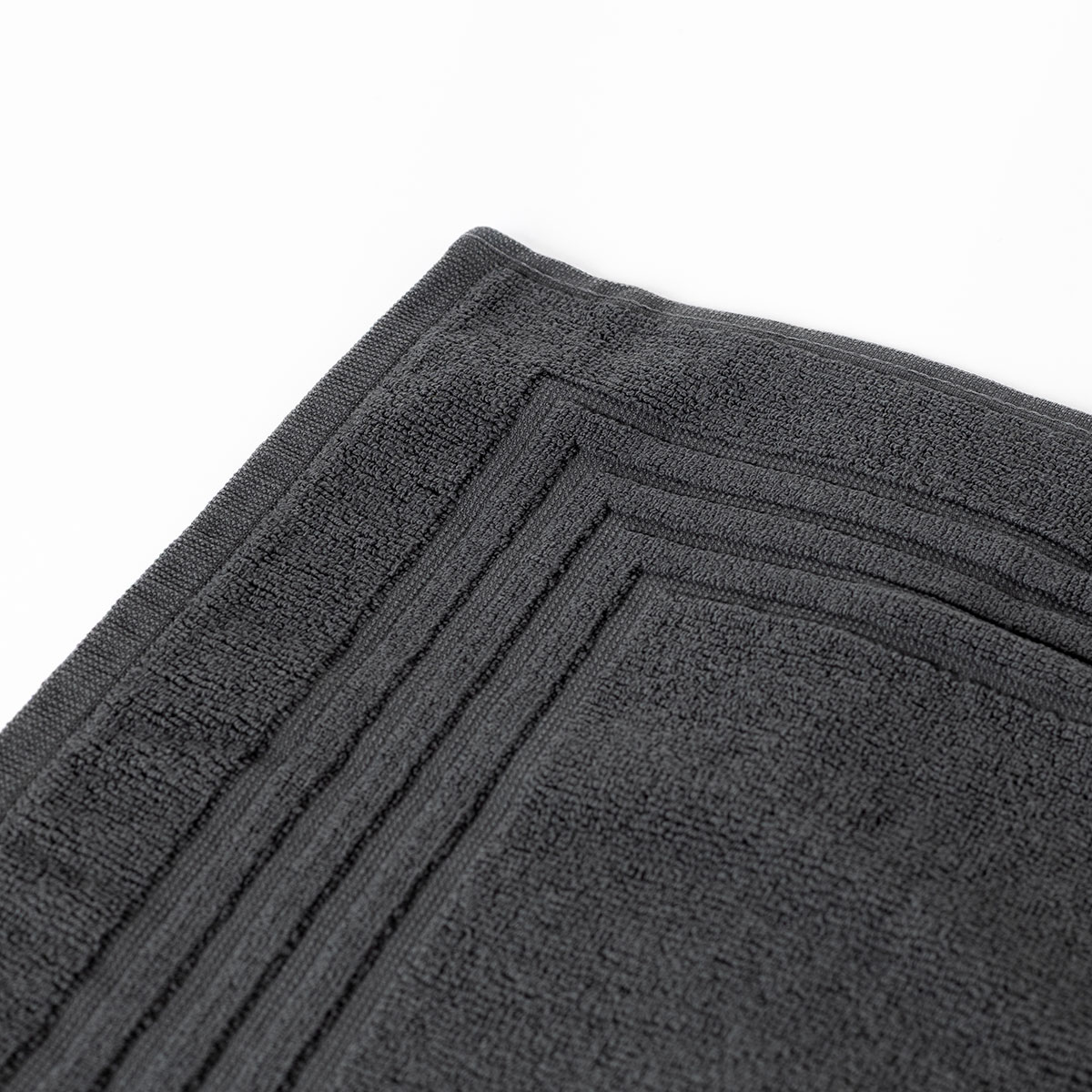 Alfombra de ba&ntilde;o ESSENZA gris oscuro 50x70cm